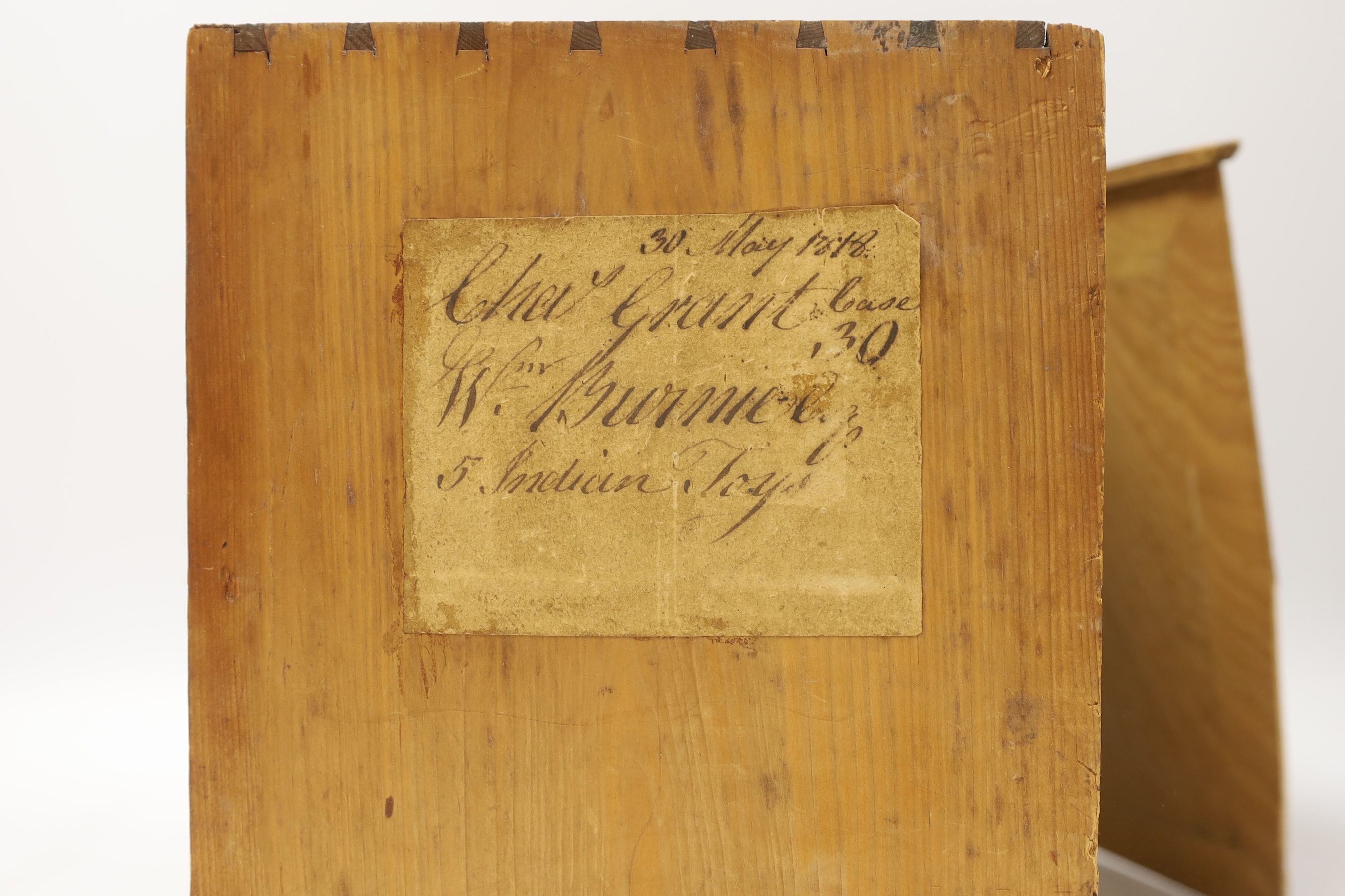 A Chinese card, paper and silk diorama depicting a seated artisan at a spinning wheel, 19th century, (label to the side of box) 22cm wide x 24.5 cm high